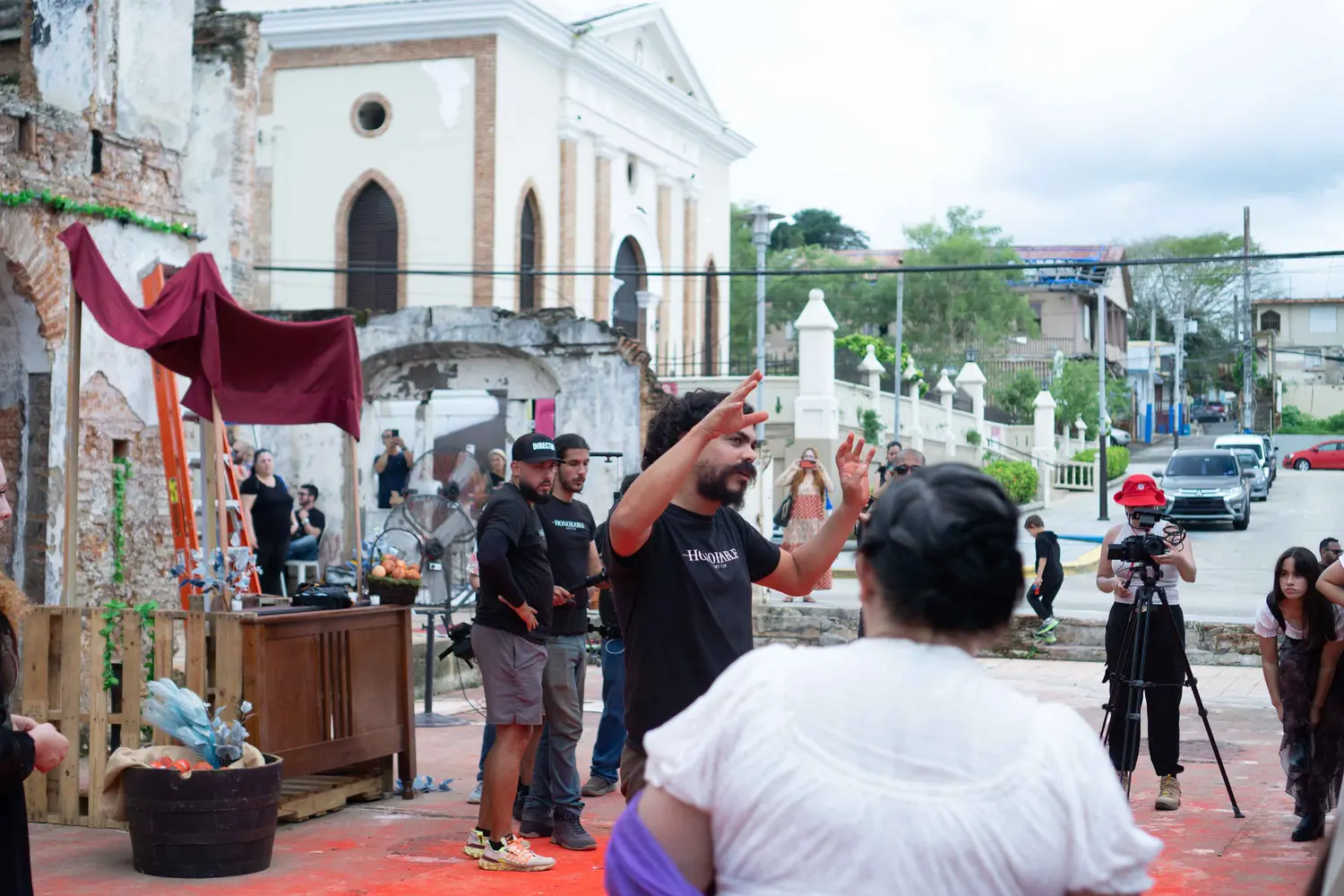 A town plaza and church seen past the set dressing